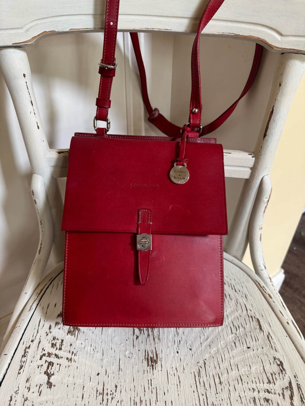 Vintage Dooney & Bourke Crossbody Flap Bag heat embossed logo, silver tag